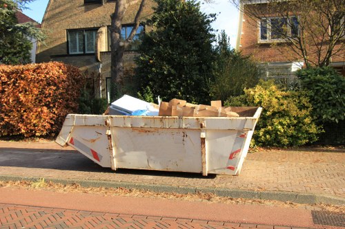 Various types of furniture being cleared in Hornsey