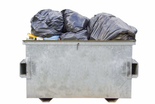 Commercial waste removal truck parked at a Hornsey business site.